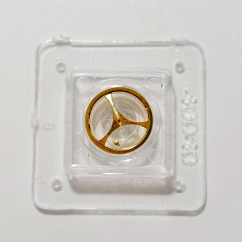 Golden balance wheel with hairspring for Orient 46941/46943 watch movement, precise timekeeping part.