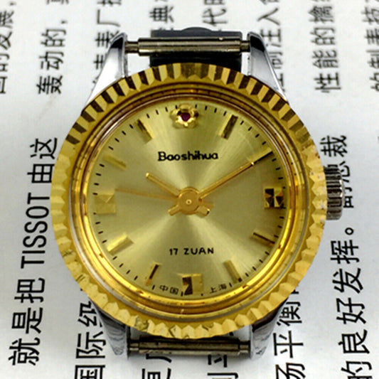 Shanghai 24mm lady watch with golden nail markers, round gold case, and manual mechanical 3-hand movement.