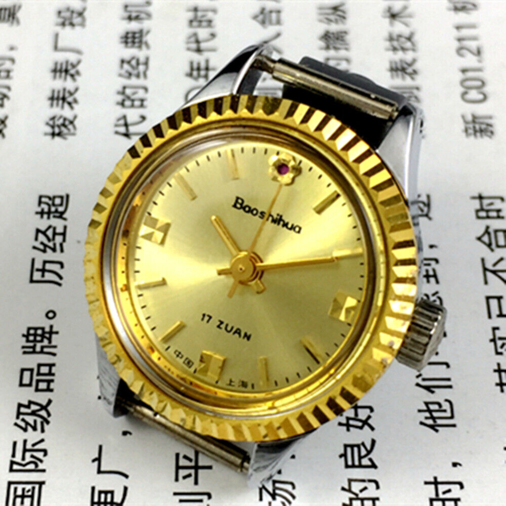 Shanghai 24mm lady watch with gold nail markers, round gold case, and manual mechanical movement by Shanghai brand.