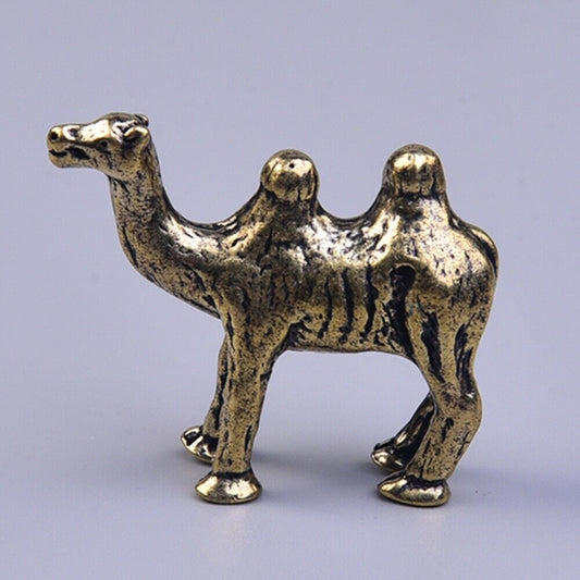 Hand-carved solid copper camel trinket, vintage bronze-toned collectible figurine.