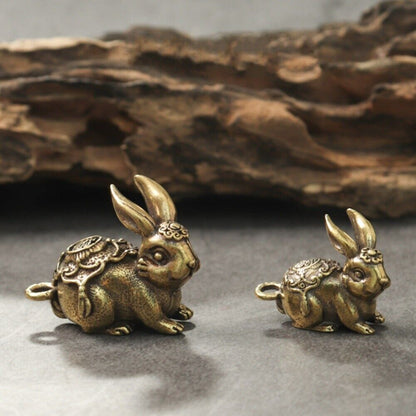 Hand-carved Blessing Rabbit pendant in solid copper, detailed bronze trinket for collectors.