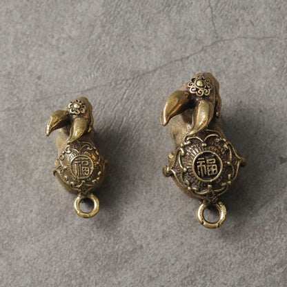 Hand-carved Blessing Rabbit pendant in solid copper, detailed bronze accessory for watch lovers.