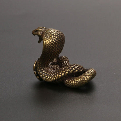 Hand-carved solid copper cobra trinket with vintage bronze finish, collectible decor for home or office.