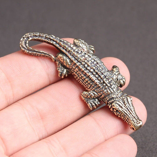 Hand-carved solid copper crocodile figurine by Bronze Model, detailed trinket for watch accessory displays.