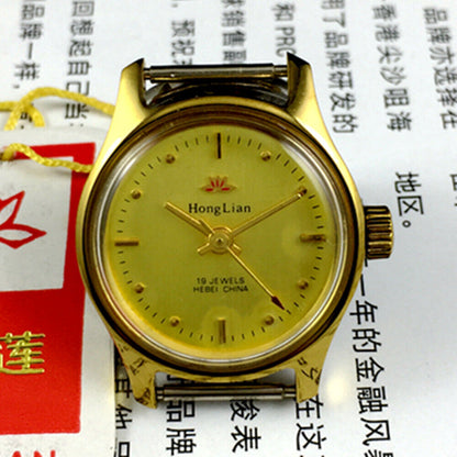25mm HONGLIAN lady watch with golden nail markers, round golden case, and manual mechanical movement.