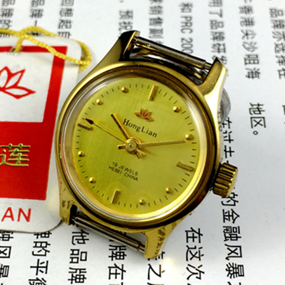 25mm HONGLIAN lady watch with golden nail markers, round golden case, and intricate manual mechanical movement.