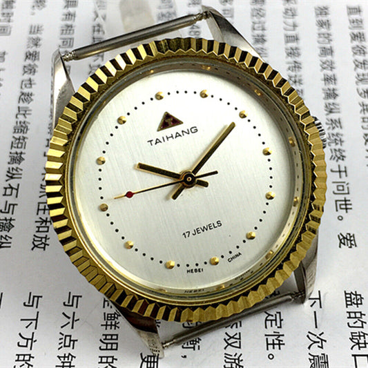 38mm TAIHANG manual watch with silver dial, round case, 3 hands, and 17 jewels for precision.