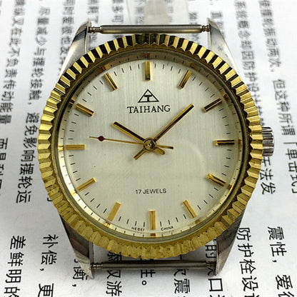 TAIHANG 38mm manual mechanical watch with golden nail markers, silver dial, round case, 17 jewels details.