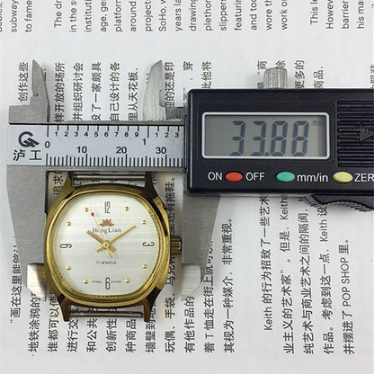33mm HONGLIAN manual watch with golden numerals, square case, classic style for elegant wristwear.