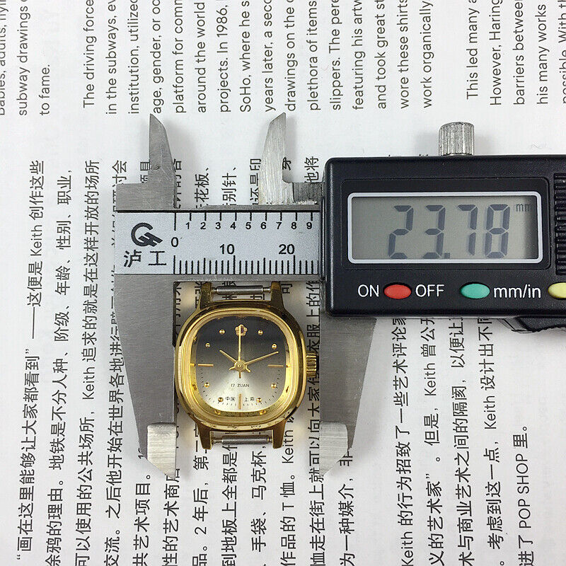 Golden 23mm Shanghai Lady Watch with square case, 17 jewels, manual mechanical movement, elegant design by Shanghai.