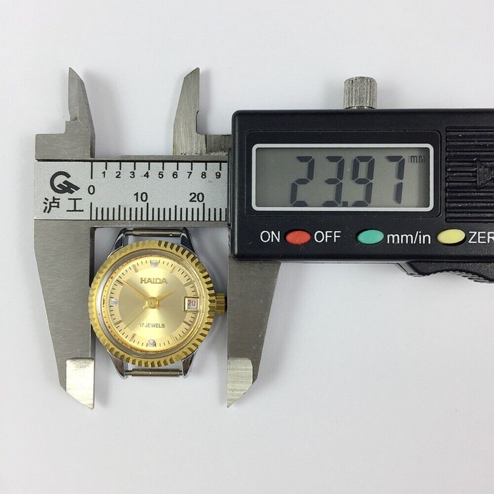 HAIDA 23mm gold manual mechanical lady watch with 17 jewels, elegant round golden case for stylish wear.