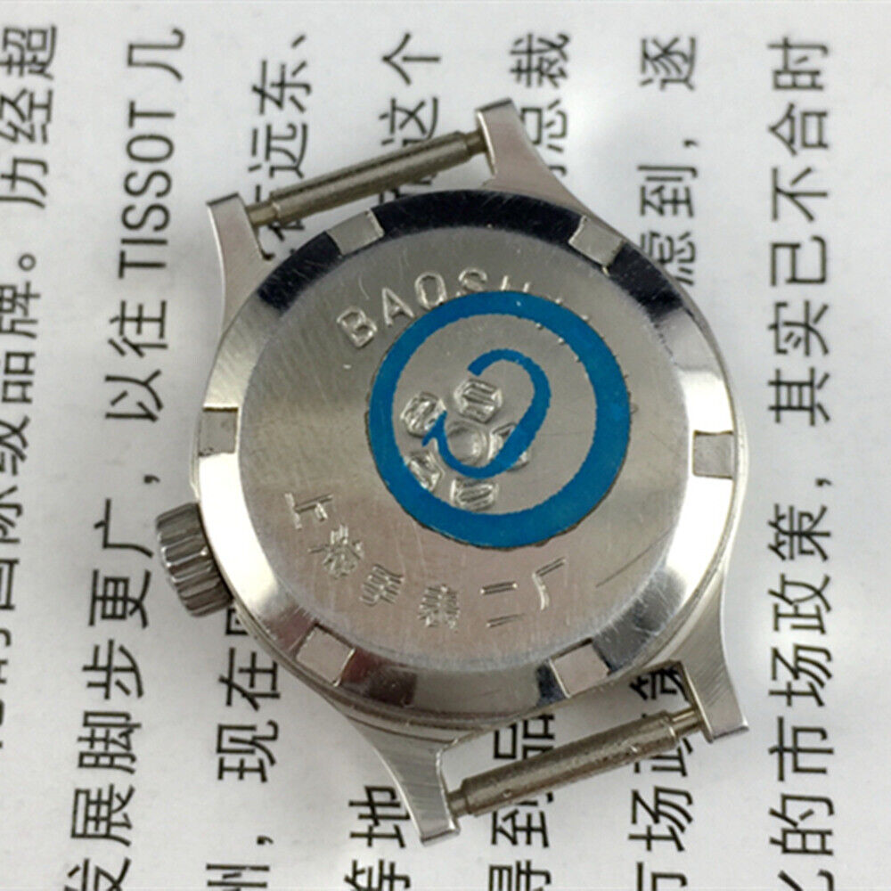 23mm Shanghai Lady Watch with golden nail markers, round gold case, and manual mechanical movement by Shanghai.