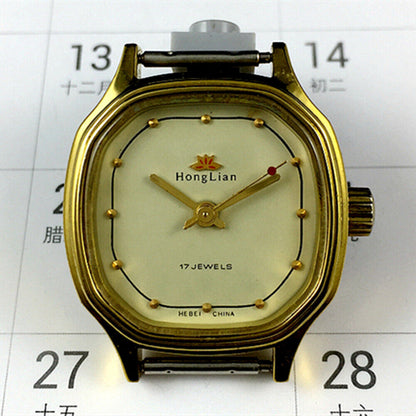 Elegant 27mm HONGLIAN manual mechanical lady watch with golden nail markers and octagonal golden case.