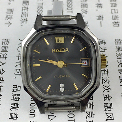 HAIDA 24mm black dial lady watch with octagonal case, manual mechanical movement, 17 jewels for precision.
