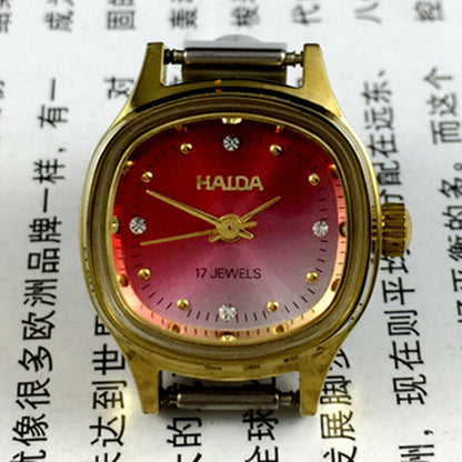 HAIDA 24mm lady watch with manual mechanical movement, diamond-style nails, and gradient red dial.
