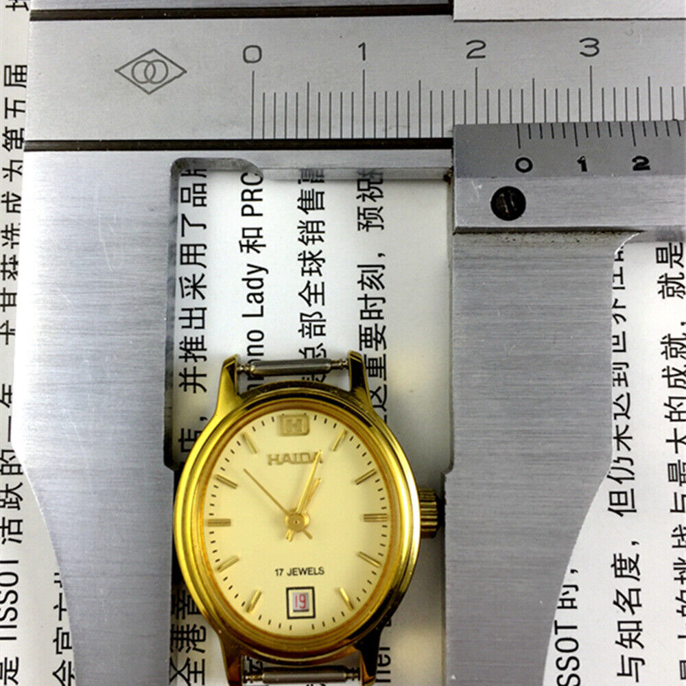 Golden oval watch case 23mm, manual mechanical lady watch with single calendar at 6 o?clock.