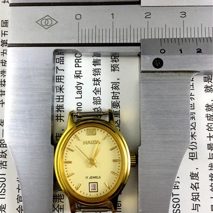Golden oval watch case 23mm, manual mechanical lady watch with single calendar at 6 o?clock.