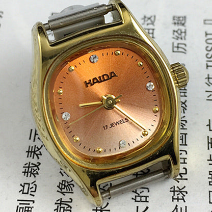 Haida 24mm ladies mechanical watch with golden nail markers and gradient orange dial, 17 jewels.