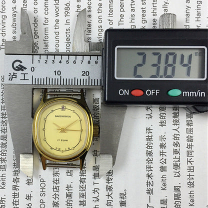 Montre mécanique manuelle Shanghai pour femme, cadran jaune à clous dorés, boîtier ovale, 17 pouces