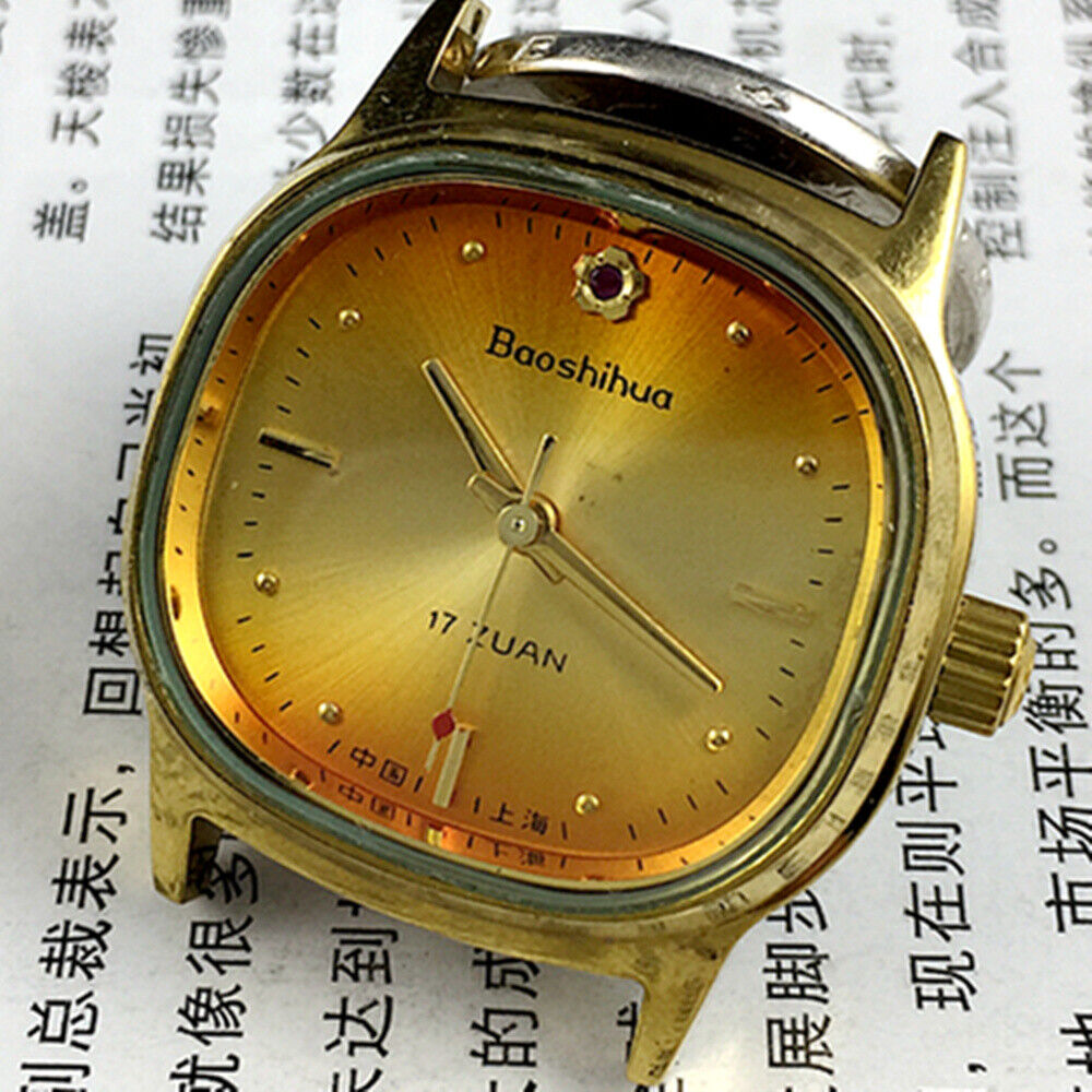 33mm Shanghai watch featuring golden nail markers, 17 jewels, square case, and vibrant orange dial for elegant style.