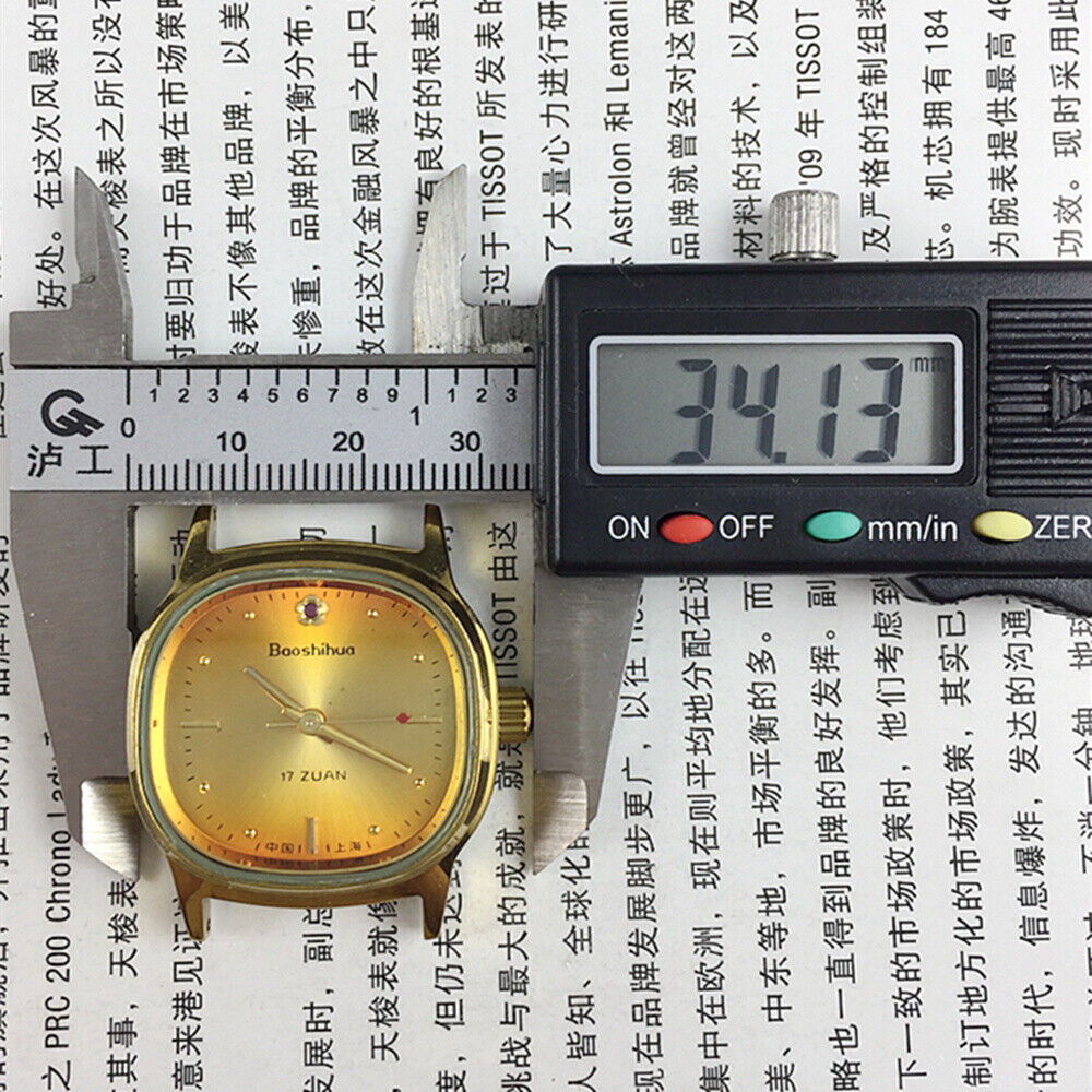 33mm Shanghai watch with golden markers, 17 jewels, square case, orange dial, elegant vintage design.