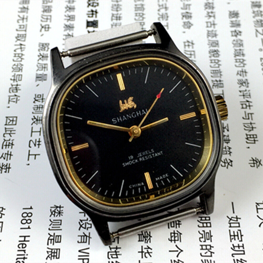 Shanghai Factory 34mm manual mechanical watch with black dial, 19 jewels, shock-resistant for durable wear.