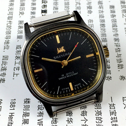 Shanghai Factory 34mm manual mechanical watch with black dial, 19 jewels, shock-resistant for durable wear.