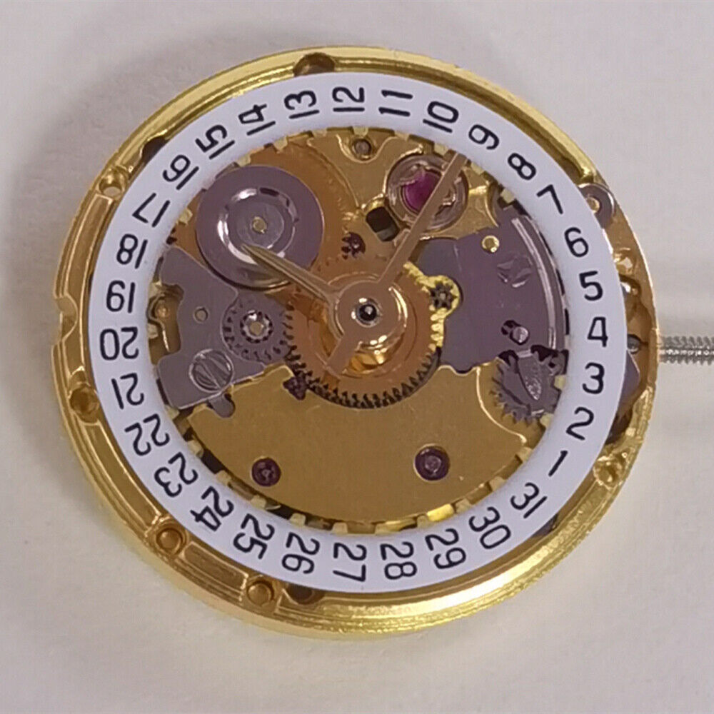 Golden mechanical watch with date display at 3 o'clock, ETA2671 replacement, precision craftsmanship.
