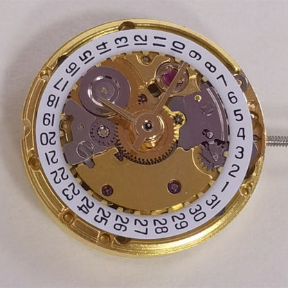 Golden mechanical watch with date display at 3 o'clock, ETA2671 replacement, precision craftsmanship.