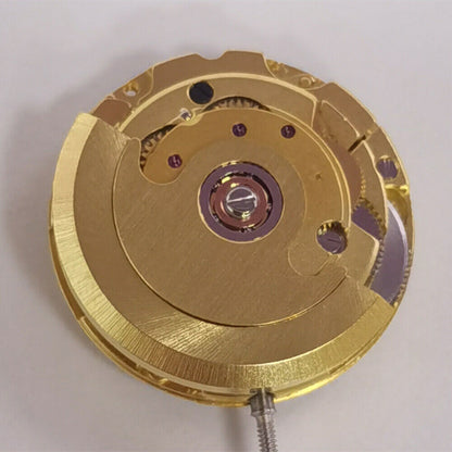 Golden mechanical watch showcasing date at 3 o'clock, ETA2671 movement, precision craftsmanship.