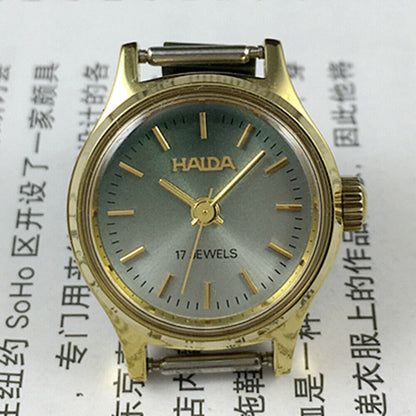 23mm SHANGHAI HAIDA lady watch with golden nails and blackish green dial, manual mechanical movement.