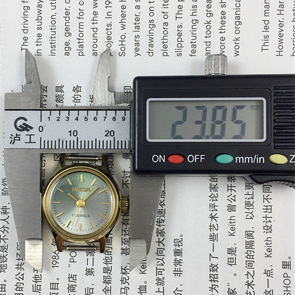 23mm SHANGHAI HAIDA lady watch with golden nails and black-green dial, manual mechanical movement, elegant design.