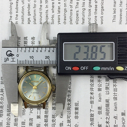 23mm SHANGHAI HAIDA lady watch with golden nails and black-green dial, manual mechanical movement, elegant design.