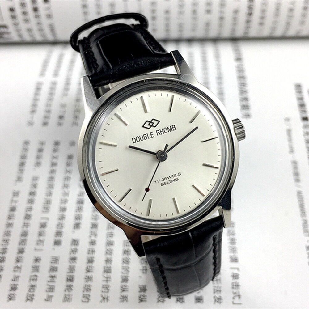 Beijing 36mm Double Rhomb watch with silver case and silver nail straps, manual mechanical movement, elegant style for formal wear.