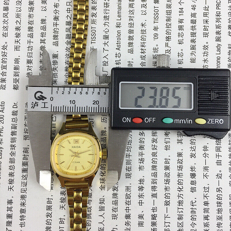 Shanghai Haida 24mm lady watch with golden nail accents and square mechanical case for elegant style.