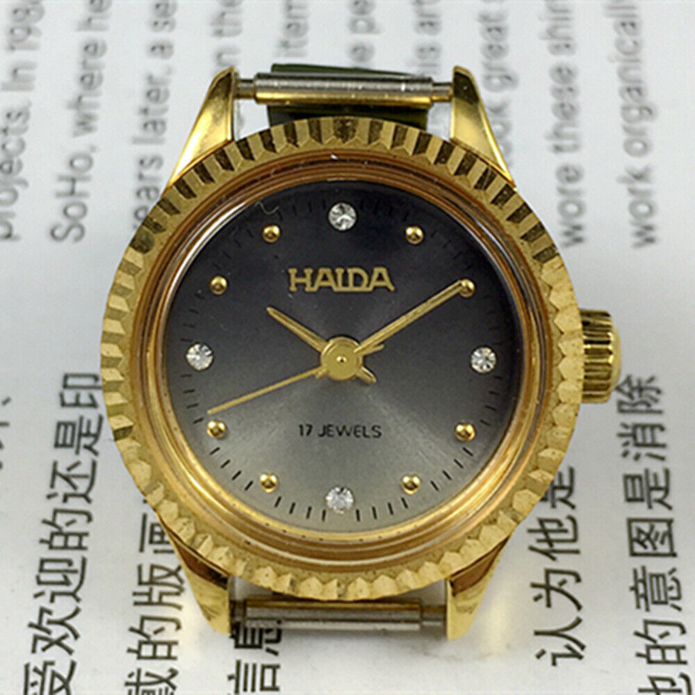 24mm Shanghai Haida manual mechanical lady watch with 17 jewels and imitation diamond markers.