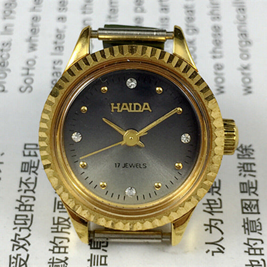 24mm Shanghai Haida manual mechanical lady watch with 17 jewels and imitation diamond markers.