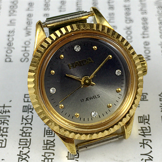 24mm Shanghai Haida manual mechanical lady watch with 17 jewels and imitation diamond markers.