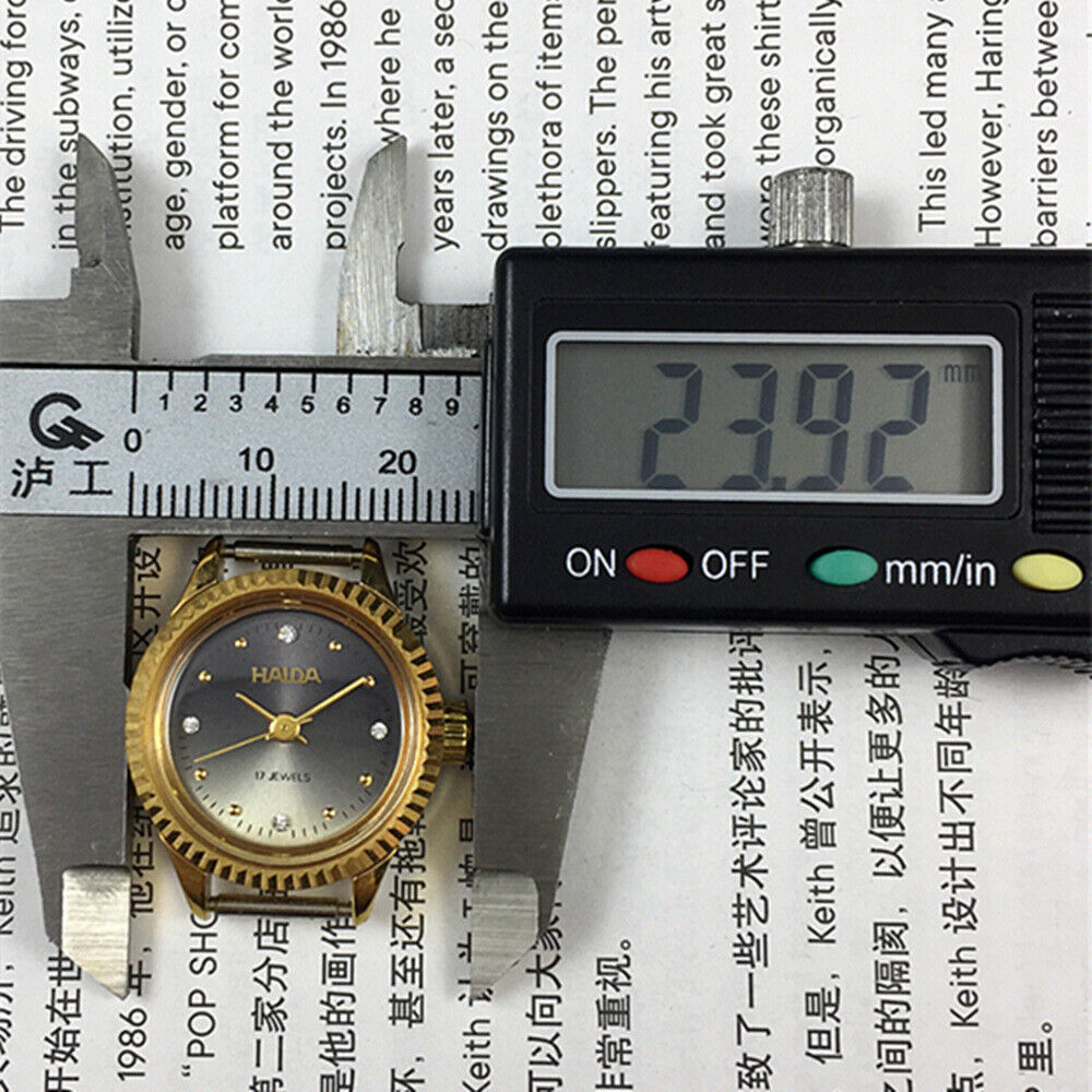 24mm Shanghai Haida ladies manual watch with 17 jewels and sparkling diamond-like markers.