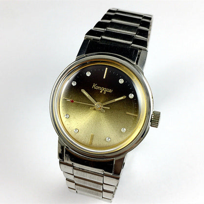 China Kongque Steel manual watch featuring 17 jewels and a gradual golden brown dial with elegant design.