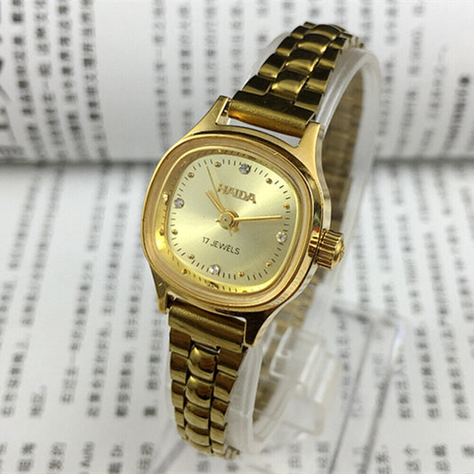 24mm SHANGHAI HAIDA lady watch with golden nail markers and champagne dial, manual mechanical movement.