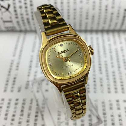 24mm SHANGHAI HAIDA lady watch with golden nail markers, champagne dial, manual mechanical movement.