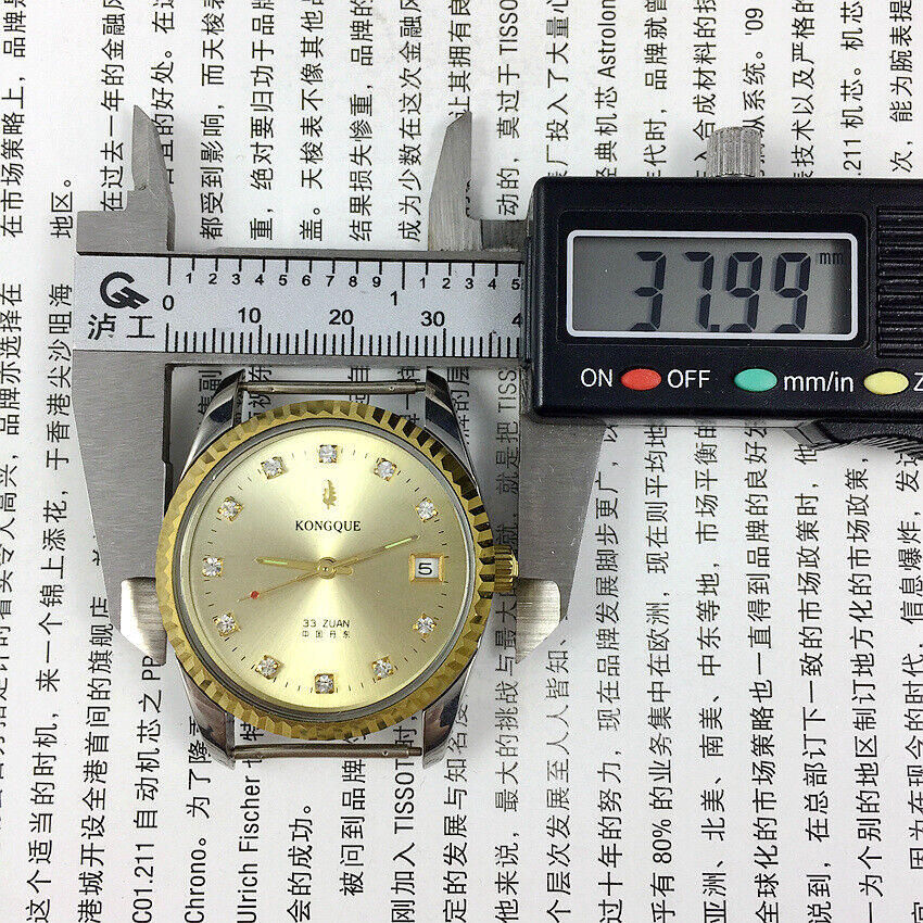 37mm Dandong Peacock watch with golden dial, manual mechanical movement, 33 jewels, single calendar display.