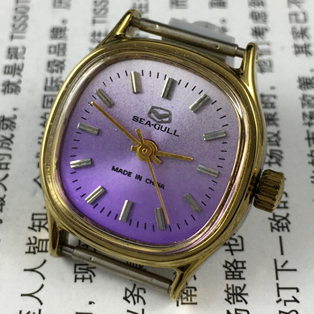 Seagull 27mm purple dial ladies watch with square case and manual mechanical movement.