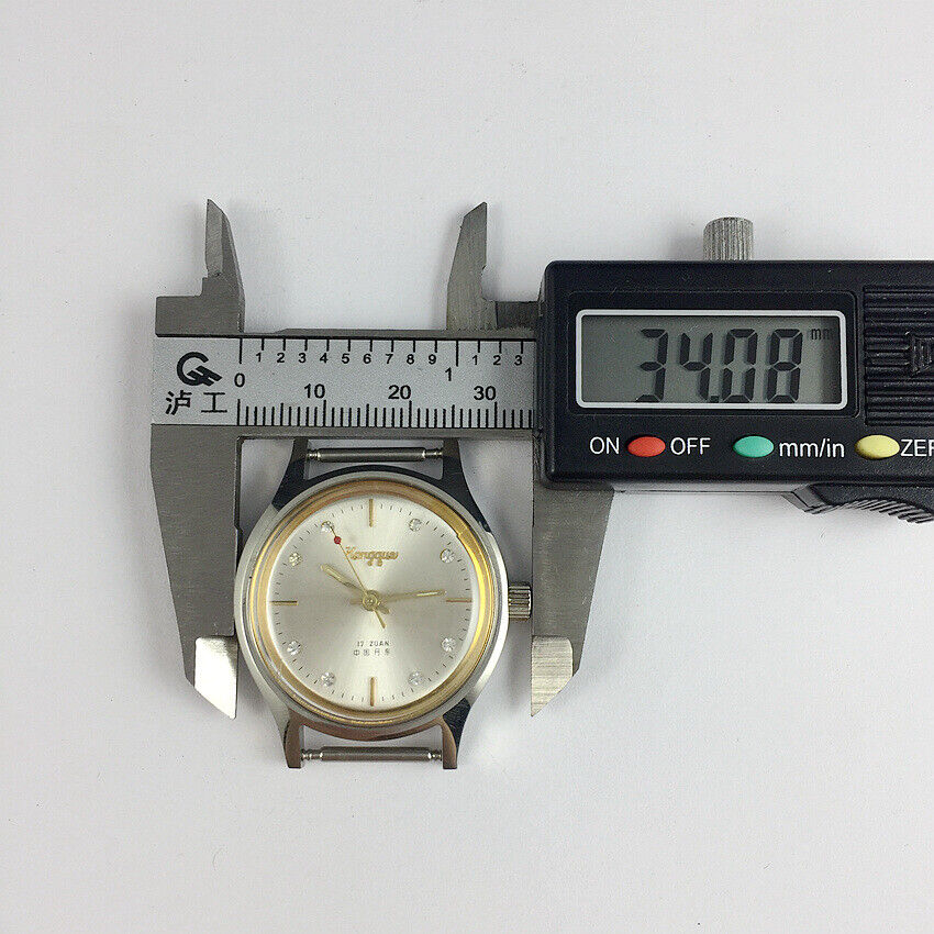 33mm China Kongque steel manual watch with silver dial, 17 jewels, and durable watch band for everyday wear.