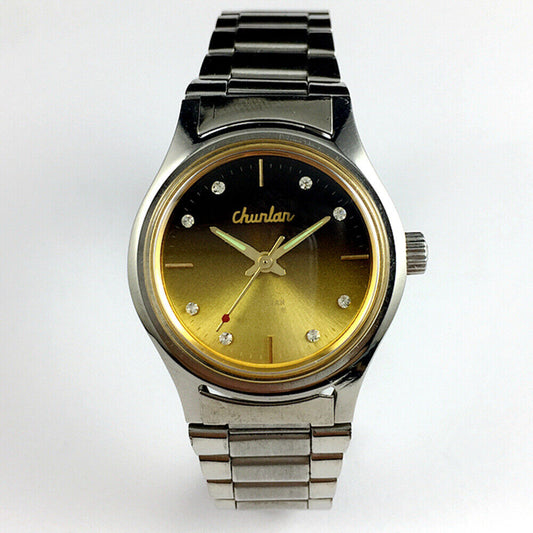 China Chunlan Steel mechanical watch with 17 jewels, gradual golden brown dial, and classic design.