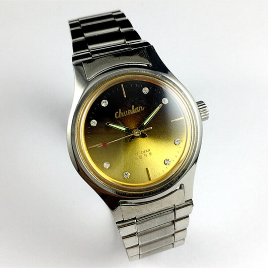 China Chunlan Steel mechanical watch with 17 jewels, gradual golden brown dial, and classic design.