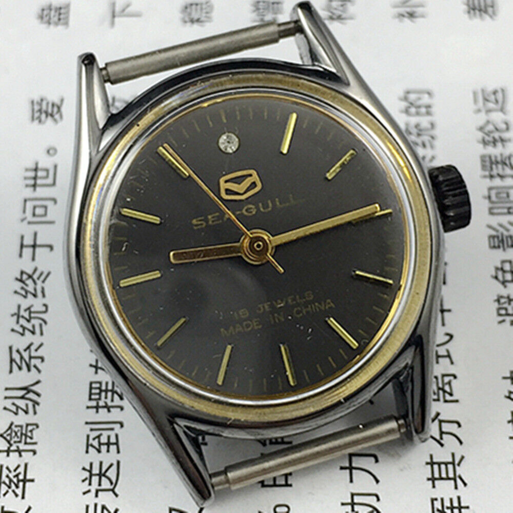 Seagull 26mm ladies watch with black case, gold nail markers, manual mechanical movement, stylish accessory.