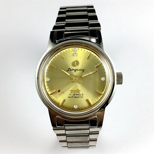 China Donglang Steel automatic mechanical watch with 17 jewels, golden dial, and matching steel band.