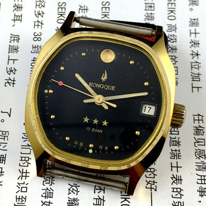 China Kongque Steel manual mechanical watch, 17 jewels, black dial, gold case for elegant style and precision.